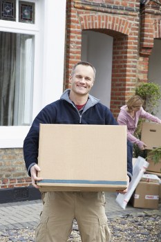 Removal team preparing a home move in Willesden with boxes and furniture