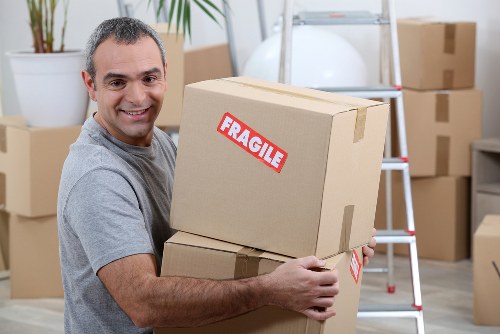Removal van and moving team handling a home move in Willesden