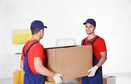 Furniture and boxes loaded into a van for transport in Willesden