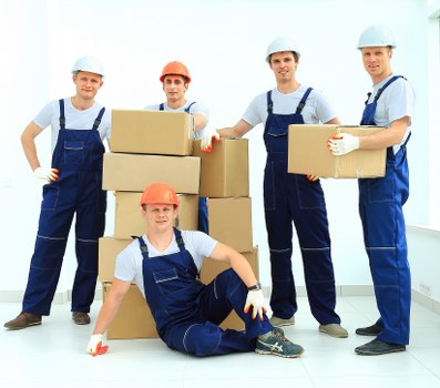 House removal team helping with moving day in Willesden