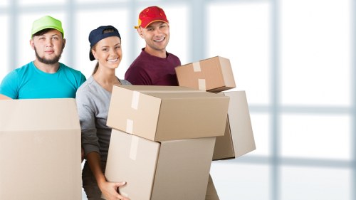 Boxes and furniture arranged for a home move in Willesden