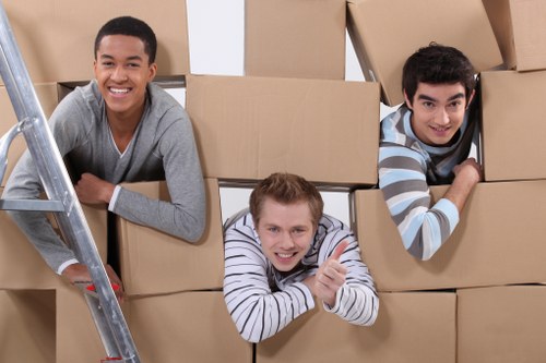 Loading boxes and furniture into a removal van for a Willesden move