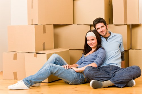 Packed moving boxes and furniture ready for transport in a Willesden home move