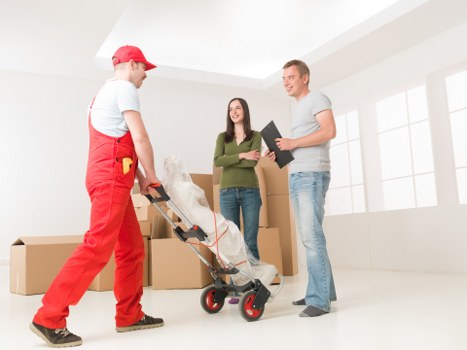 Local removals team handling furniture near Willesden streets