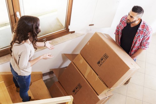 Local movers handling furniture and equipment during a Willesden relocation