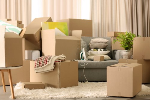 Careful loading of household items into a removal van in Willesden